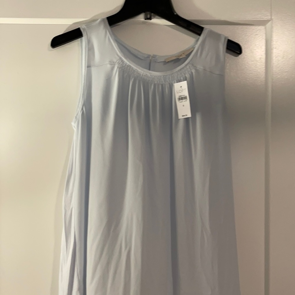 Pale blue sleeveless blouse